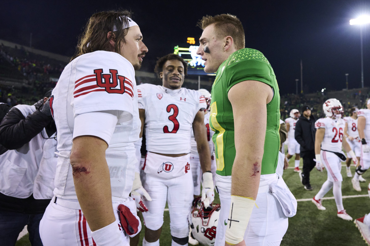 Utah Utes quarterback Cameron Rising (7), left, talks to Oregon Ducks quarterback Bo Nix (10) after a game at Autzen Stadium. The Ducks won the game 20-17.